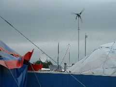 Dish, wireless antennae and wind generator.